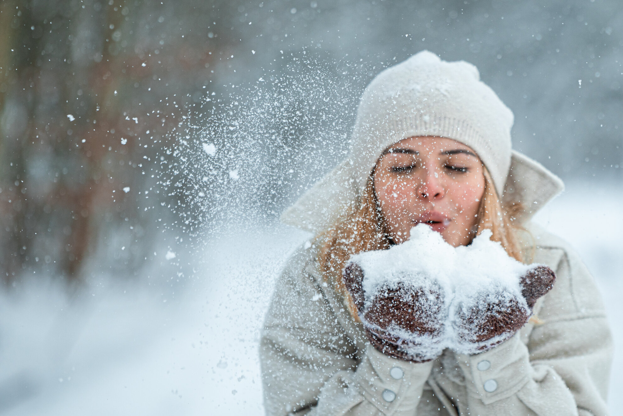 girl playing with snow